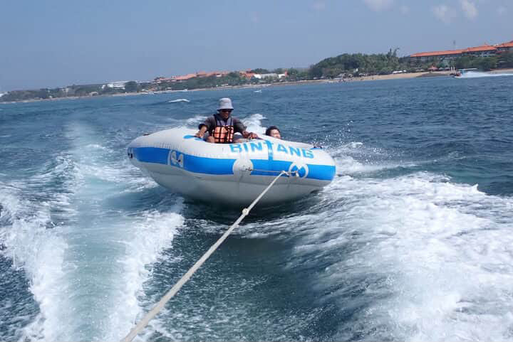 Customers on a banana boat watersport activity