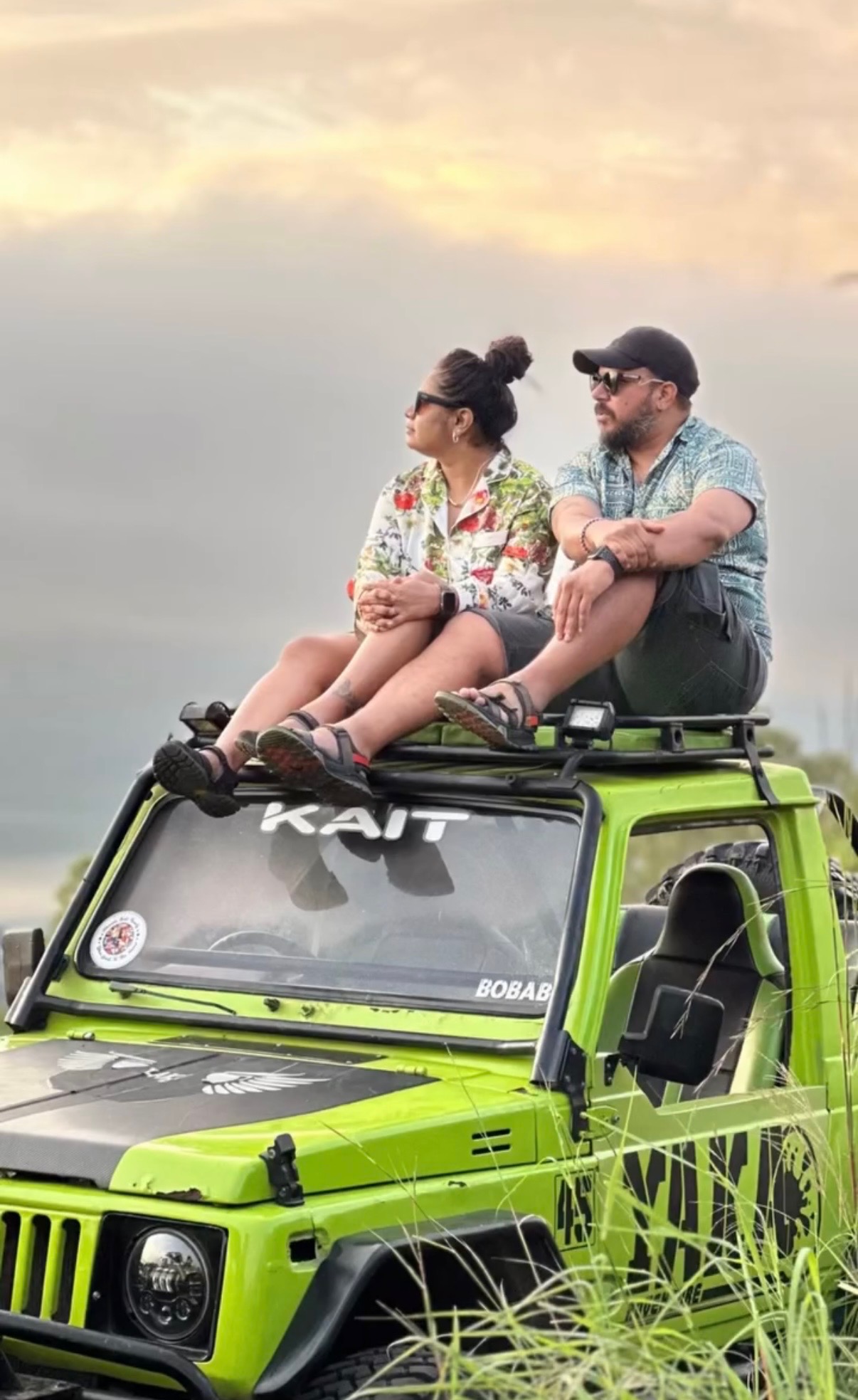 Customers sitting on a green Bali sunrise jeep