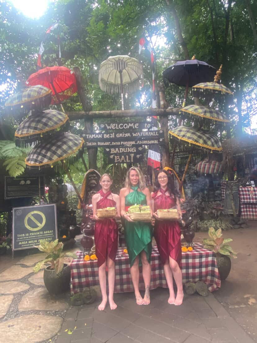 Customers posing at a Bali attraction