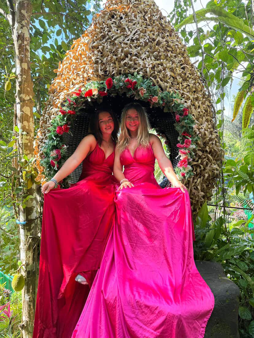 Customer on a Bali swing in a pink dress